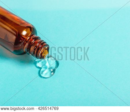 Hydrating Sanitizer Blob Gel In Glass Bottle Container. Transparent Serum Or Moisturizer Texture For