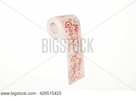 Merry Christmas Text On Toilet Paper. Holiday Overeating Concept. Toilet Tissue, Isolated White Back