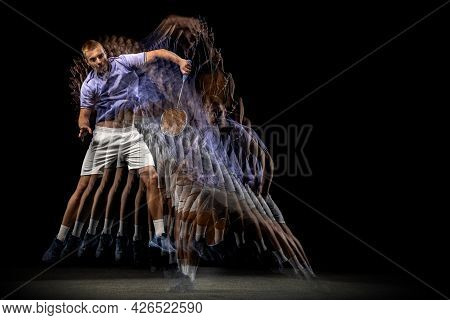 One Young Male Badminton Player, Shuttler Training Isolated On Dark Background. Stroboscope Effect.