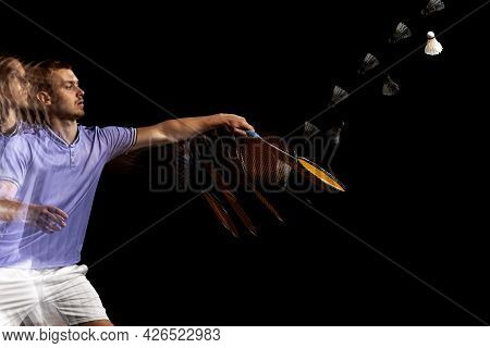 Spectacular Trajectory Of Movement. One Young Male Badminton Player, Shuttler Training Isolated On D