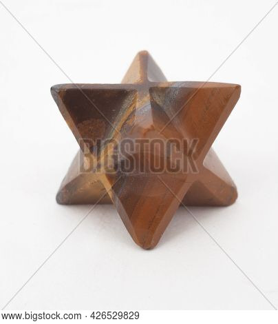 A Wooden Mercaba Photographed Against A White Background