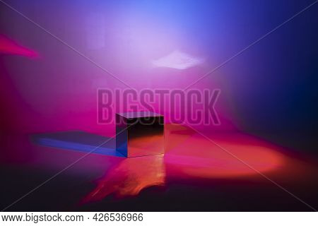 Pink And Blue Neon Lighted Background. Mirror Light Cube With Copy Space