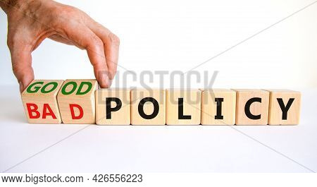 Good Or Bad Policy Symbol. Businessman Turns Wooden Cubes And Changes Words 'bad Policy' To 'good Po