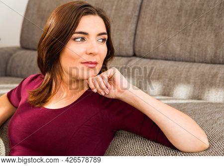 Porttrait of a beautiful woman thinking