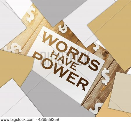 Words Have Power Text On Page And Paper Dollar Signs Around On Wooden Table. Copywritting Storytelli