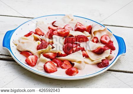 Russian Food, Pasta With Strawberries Called Vareniki Or Warenike. Sweet Traditional Summer Meal.