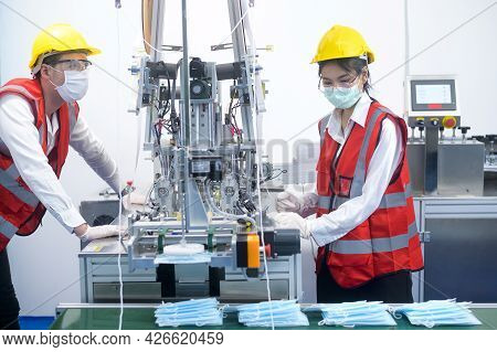 Quality Control (qc) Engineer Monitoring And Checking Machine System In Manufacturing Factory