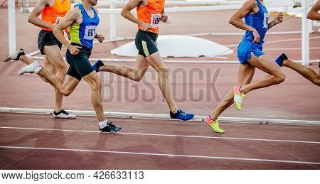 Group Runners Athletes On Middle Distance Run Stadium