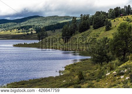 Lake Uzunkel Is Surrounded By Mountains And The Siberian Taiga. Ulagansky District, Altai Republic, 