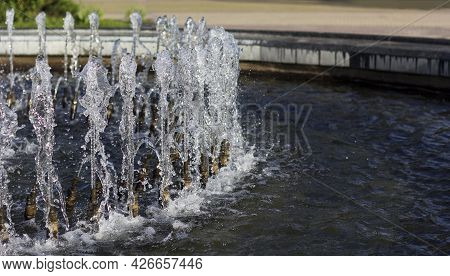 Summer Heat. Fountain In The City. Freshness And Coolness