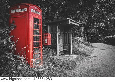 Traditional Red British Telephone Booth, Post Box And Wooden Bus Stop, Selective Color On Black And 