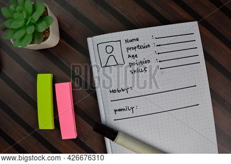 User's Persona Write On A Book Isolated On Wooden Table.
