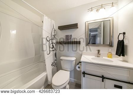 Small Bathroom Interior With Dark And White Theme Creating A Minimalist Design