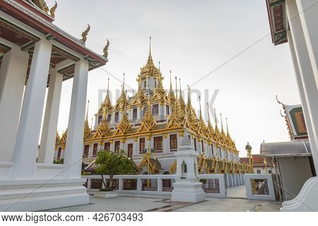 Loha Prasat At Wat Ratchanatda Temple With Blue Sky In Bangkok, Thailand.