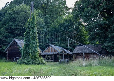 A Complex Of Historic Wooden Cottages And A Well, Bedkowice Archeological Reserve, Sobotka, Poland. 