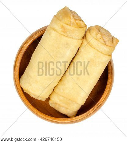 Unfried Spring Rolls, In A Wooden Bowl. Two Spring Rolls, Ready To Fry. Filled And Rolled Wrappers, 