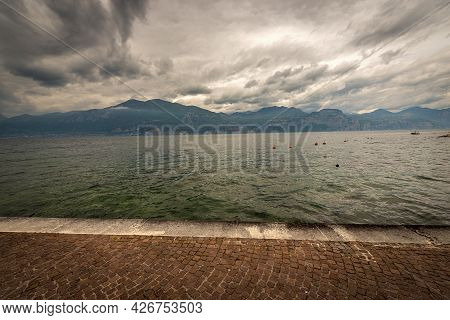 Lago Di Garda. The Lake Garda View From The Port Of The Small Village Of Castelletto Di Brenzone, Br