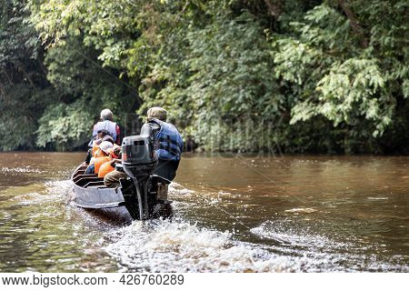 River Cruise Along Scenic Tahan River With Lush Rainforest Foliage At Taman Negara National Park, Pa