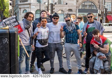 London - May 29, 2021: Protesters Pose For A Photograph At A Freedom For Palestine Protest Rally Out
