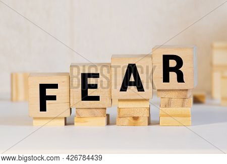 Fear Word Written On Blocks. Posttraumatic Stress Disorder Inscription On Yellow Background. Medical