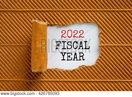 2022 Fiscal New Year Symbol. Words '2022 Fiscal Year' Appearing Behind Torn Brown Paper. Beautiful B