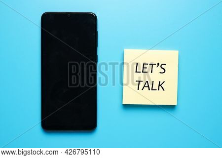 Smartphone And The The Word Let's Talk On Notepad. Commmunication And Problem Solving Concept.