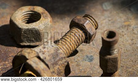 Old Rusty Bolt, Iron Rod With Screw Threads. Rusted Mechanical Components. Threaded Bolt And Nut. Di