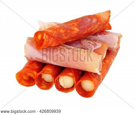 Group Of Serrano Ham And Chorizo Rollitos Filled With Gouda And Iberico Cheese Isolated On A White B