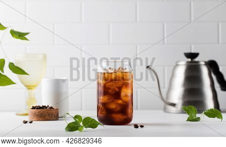 Cold Black Coffee With Ice Cubes On A White Background. Coldbrew. Summer Drinks.