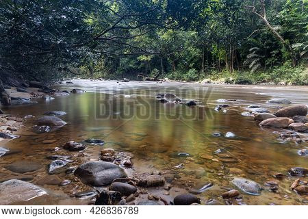 Scenic Nature View Of Tahan River With Lush Rainforest Foliage At Taman Negara National Park, Pahang