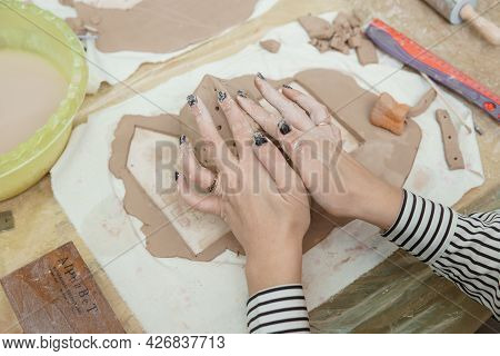 Women's Hands Knead Clay, Drawing Elements Of The Product. Production Of Ceramic Products At The Mas