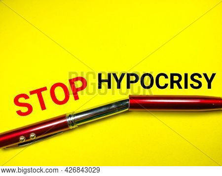 News Concept.text Stop Hypocrisy With Red Pen On A Yellow Background.