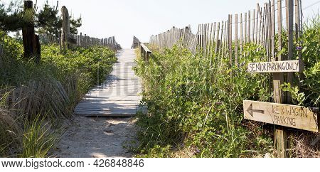 Path From Summer Homes To The Atlantic Ocean Beaches Of Fire Island With Wood On The Sand, Hand Rail