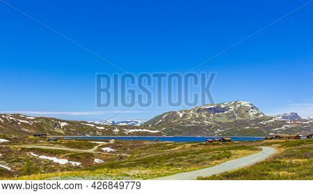 Vavatn Lake Panorama Landscape Cottages Huts Snowy Mountains Hemsedal Norway.