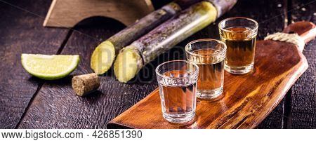 Glass Of Distilled Beverage Made From Sugar Cane, Called The Year Brazil De Pinga Or Cachaça.