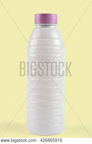 White Plastic Packaging Of Yogurt Or Milk Cut Out In Background.