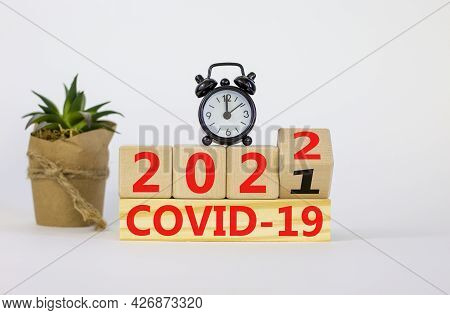 Covid-19 Pandemic In 2022 Symbol. Turned A Wooden Cube And Changed Words 'covid-19 2021' To 'covid-1