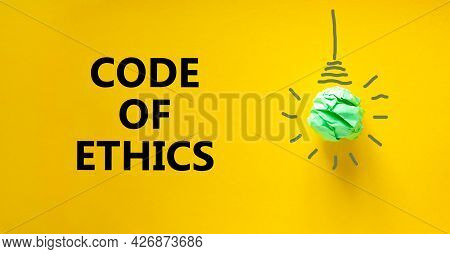 Code Of Ethics Symbol. Green Shining Light Bulb Icon. Words 'code Of Ethics'. Beautiful Yellow Backg