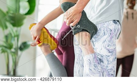 Group of people doing quadriceps stretching