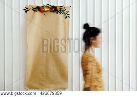Floral blankcraft paper poster on a white wall