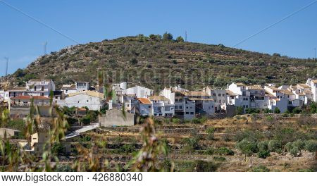 Tarbena,terraced Hillside Outside The Town With Row Of Characteristically Whitewashed Houses With Te