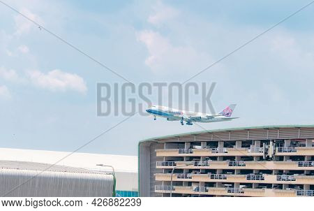 Samut Prakan, Thailand-may 15, 2021 : China Airlines Cargo Plane Flying Above Multi-story Car Park B