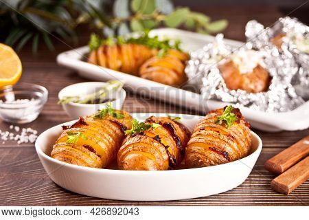 American Traditional Homemade Hasselback Potato And Stuffed Potatoes With Fresh Herbs And Bacon.