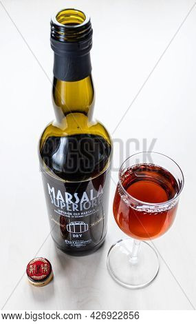 Moscow, Russia - June 10, 2021: Wineglass And Bottle Of Dry Superior Marsala From Cantine Pellegrino