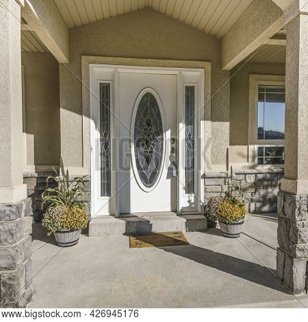 Square Frame Front Exterior Of A House With A Door With Decorative Glass Panels