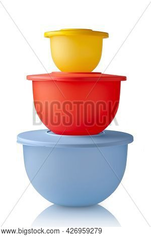 Plastic Containers Tupperware. Stack Of Colorful Plastic Bowls Isolated On White Background. Food Co
