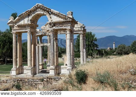 Geyre, Turkey - May 30, 2021: These Are The Ruins Of The Monumental Arch (tetrapilon) In Ancient Aph