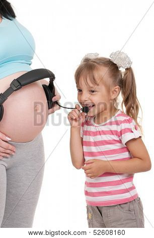 Pregnant woman with her daughter. Third trimester. 