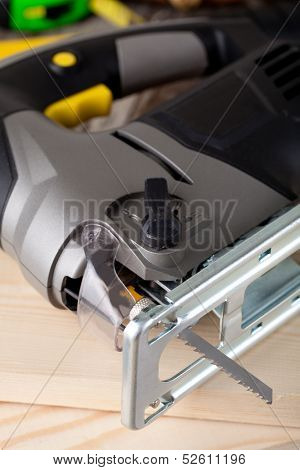 electric fretsaw on a wooden table