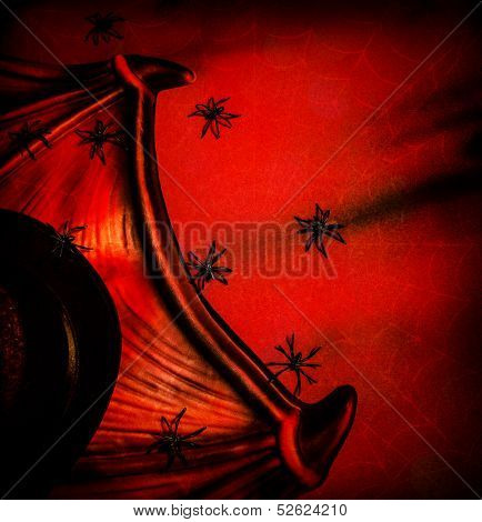 Halloween festive background, abstract dark red backdrop, many creepy spiders on Dracula collar, tall hat, post card, horror and evil concept